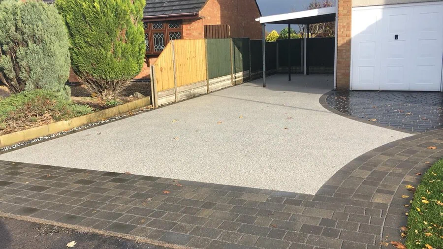 Silver resin driveway with a block paved border