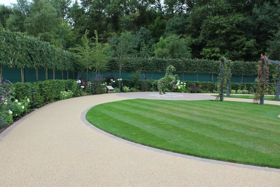 Curved resin path following the line of the lawn