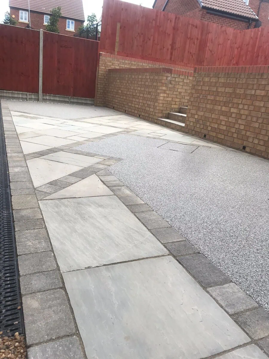 Silver resin laid alongside Indian sandstone paving