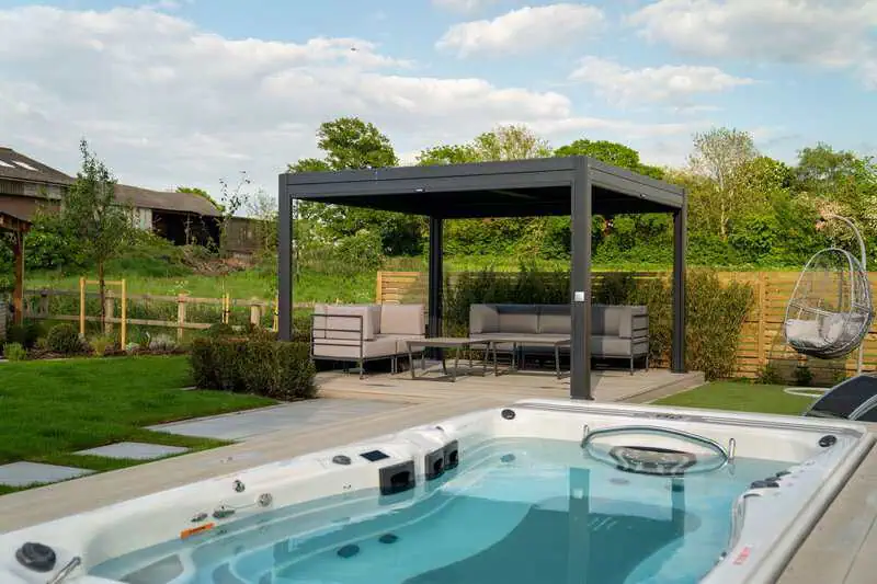 Hot tub and modern pergola in a finished luxury garden